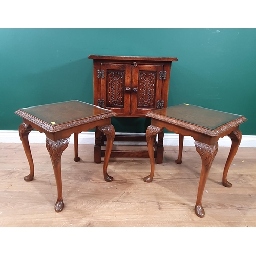 573 - A small Oak Cupboard on turned supports with a pair of Walnut Side Tables with glass tops.