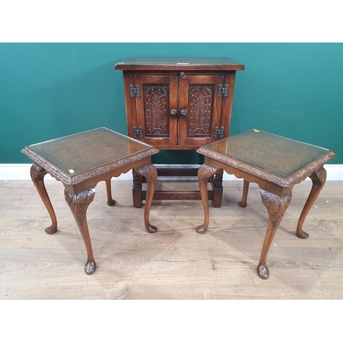 573 - A small Oak Cupboard on turned supports with a pair of Walnut Side Tables with glass tops.