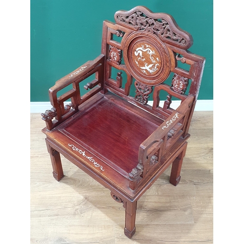 576 - A Chinese hardwood Elbow Chair with circular panel back with inlaid mother of pearl Dragon, solid se... 