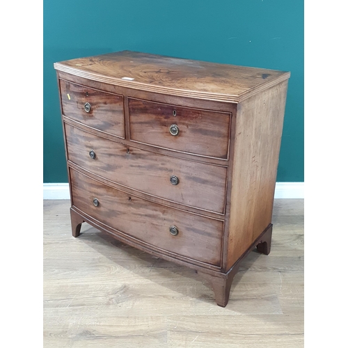 580 - A mahogany bow front Chest of two short, two long Drawers on bracket feet, 2ft 11