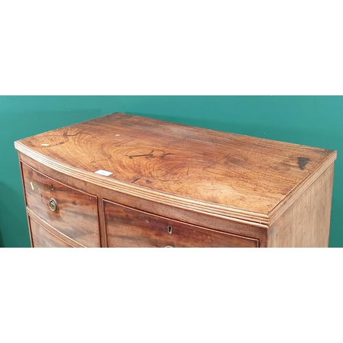 580 - A mahogany bow front Chest of two short, two long Drawers on bracket feet, 2ft 11