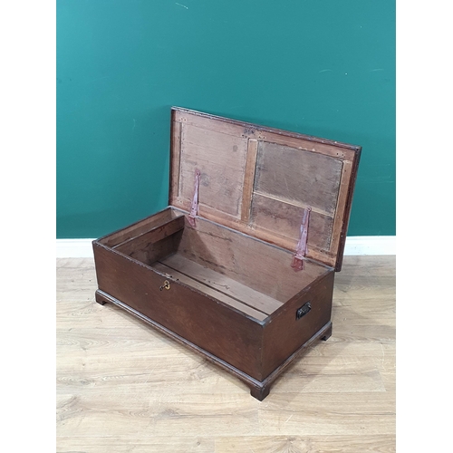 596 - An antique oak Blanket Box with panelled lid, pair of carry handles and raised on bracket feet, 13