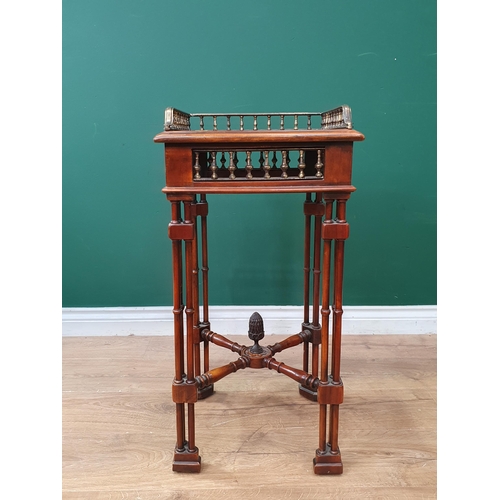 630 - A reproduction walnut Lamp Table with raised gallery, inset leather style top above column frieze, r... 