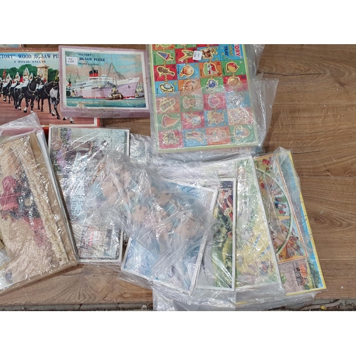 637 - A box of assorted Jigsaw Puzzles including, Western Paradise, Coastal Scene, etc. (R9).