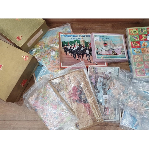 637 - A box of assorted Jigsaw Puzzles including, Western Paradise, Coastal Scene, etc. (R9).