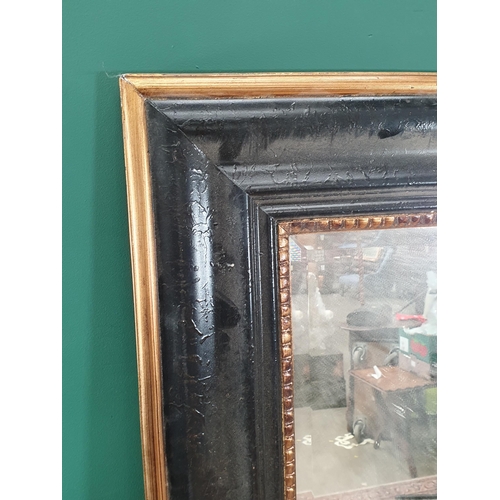 641 - A black and gilt framed Wall Mirror with bevelled plate, 5ft x 3ft. (R8).