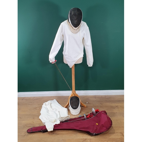 650 - Two Fencing Masks, a quantity of Epees and a Jacket and Trousers. (R6).