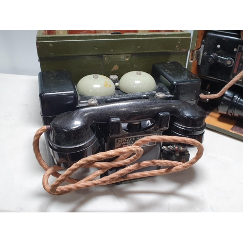 656 - Two Military Field Telephones in green cases. (R8).