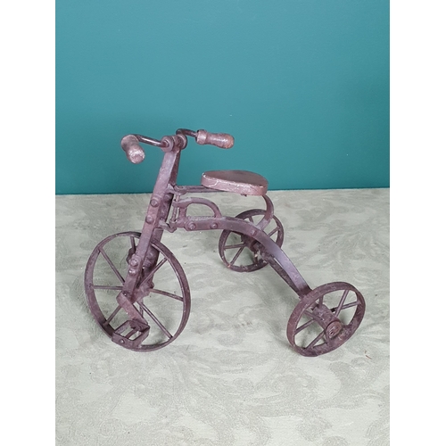 667 - A Doll's Pram and a Model of a Tricycle (R7)