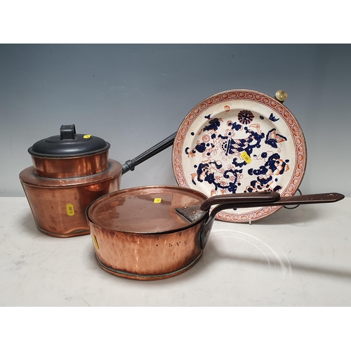 694 - A Copper Pan and Lid stamped 