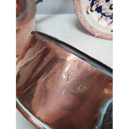 694 - A Copper Pan and Lid stamped 