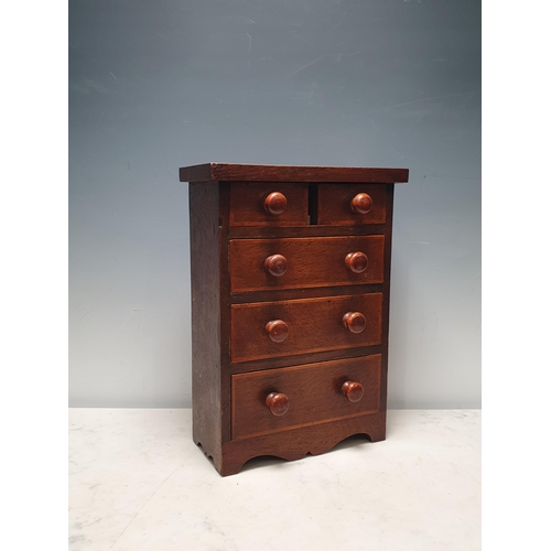 695 - An oak Apprentice Piece Chest of two short, three long graduated drawers, 13in H x 9 1/2 in W x 4 1/... 