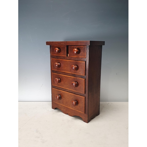 695 - An oak Apprentice Piece Chest of two short, three long graduated drawers, 13in H x 9 1/2 in W x 4 1/... 