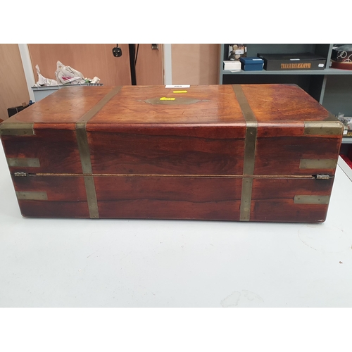 698 - An antique rosewood brass bound Writing Slope with leather gilt tooled writing surface, inscribed 