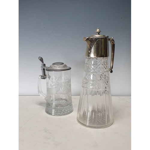 699 - A cut glass Claret Jug with plated lid and a glass Tankard with etched scene of deer (R7)