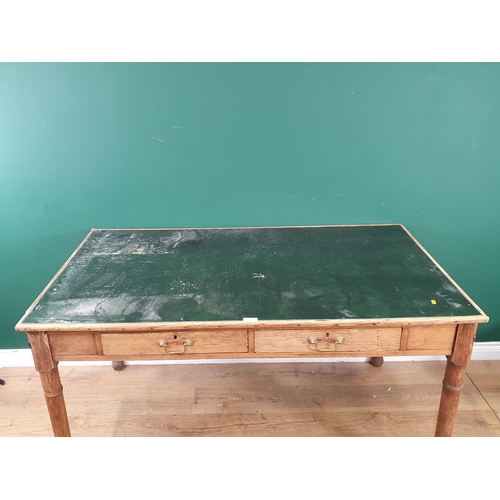 712 - A Pine Table with inset green leather style top with two fitted drawers, raised on turned supports A... 