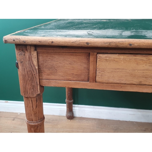 712 - A Pine Table with inset green leather style top with two fitted drawers, raised on turned supports A... 