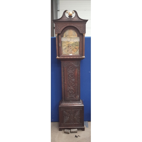 724 - An antique oak cased Long Case Clock with arched brass Dial inscribed 