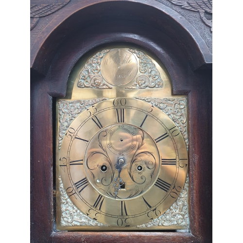 724 - An antique oak cased Long Case Clock with arched brass Dial inscribed 