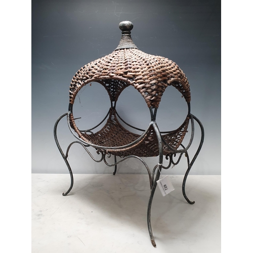 729 - A decorative wicker and wirework Basket on shaped supports, 1ft 10