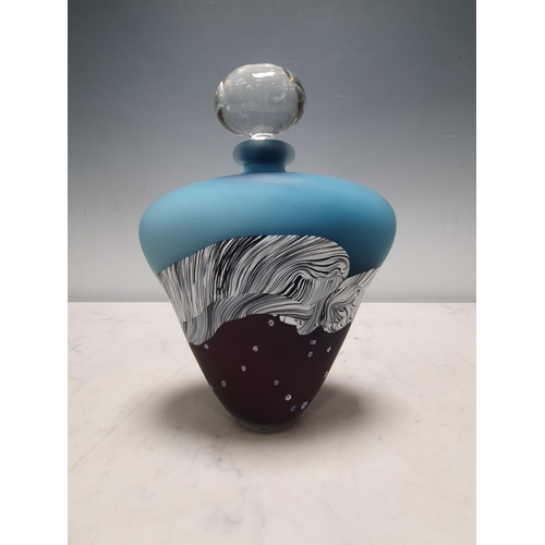 84 - A Studio Glass Flask and stopper with milliefiori design on an amethyst ground, white & black striat... 