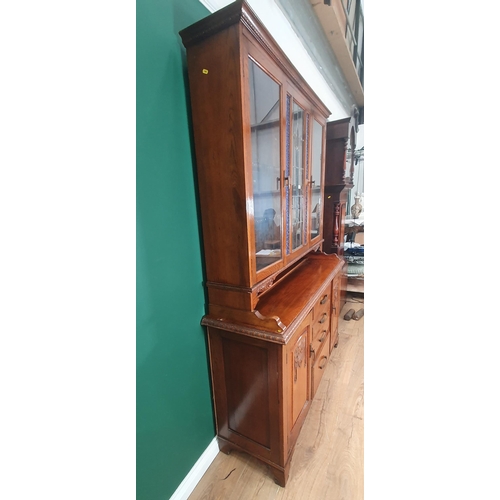 45 - An oak glazed topped Sideboard, the top with pair of glazed doors flanking central coloured glass pa... 