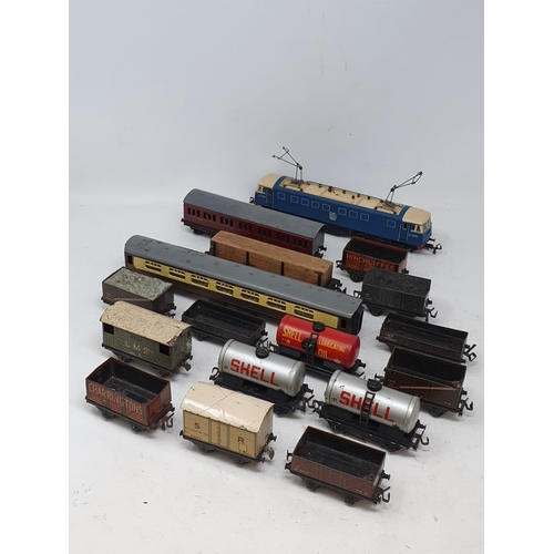 154 - Unboxed Trix E3001 electric Locomotive, two Trix Coaches and fourteen Wagons