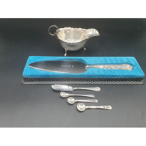 109 - A George V silver Sauce Boat, Sheffield 1913, a silver Butter Knife, three Salt Spoons and a silver ... 