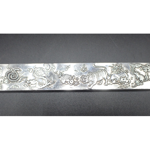 113 - A Chinese white metal Bar decorated animals including horse, monkey, lion, dragon, snake, rats etc, ... 