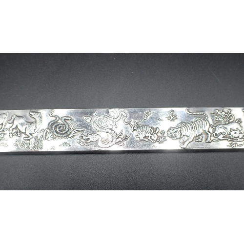 113 - A Chinese white metal Bar decorated animals including horse, monkey, lion, dragon, snake, rats etc, ... 