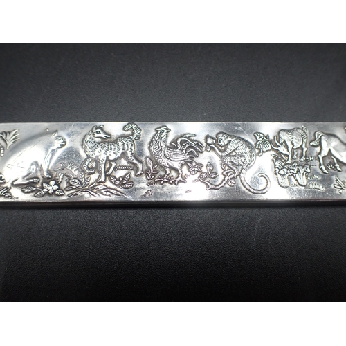 113 - A Chinese white metal Bar decorated animals including horse, monkey, lion, dragon, snake, rats etc, ... 