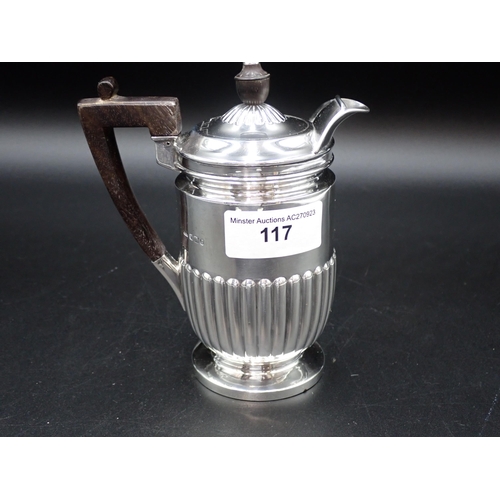 117 - A Victorian silver semi-fluted Hot Water Jug with ebonised handle, Sheffield 1899, 305 gms