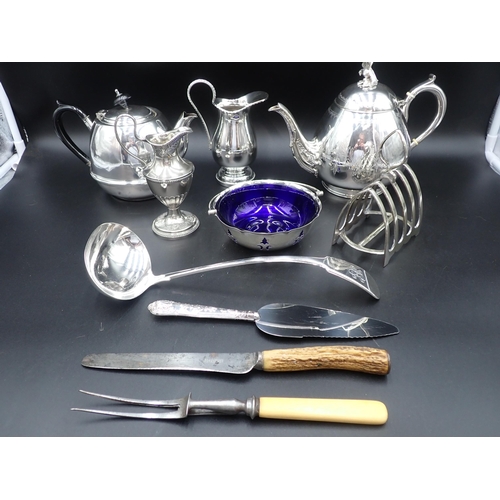 120 - Two plated Teapots, two Milk Jugs, Toastrack, Basket with blue glass liner, Soup Ladle, silver handl... 