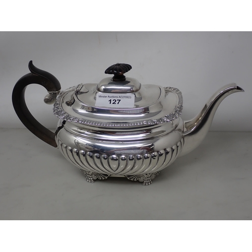 127 - A George V silver boat shape Teapot with gadroon embossing, gadroon and scallop rim on etruscan supp... 