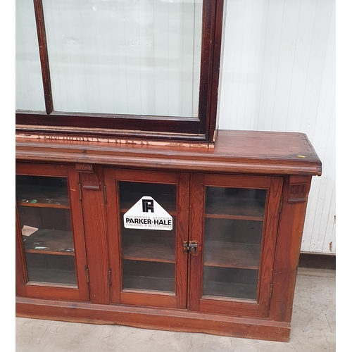 13 - A large pitch pine glazed eight door Shop Display Cabinet, 10ft 10