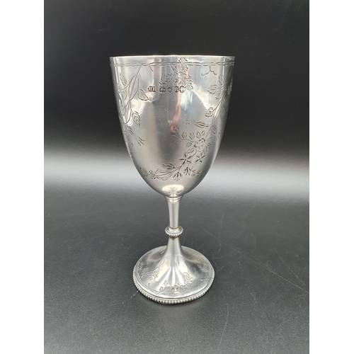 136 - A Victorian silver Goblet with floral swag engraving and inscription, London 1877, 152gms