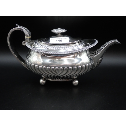 146 - A George III silver Teapot of boat shape with gadroon embossing, flower finial on four ball feet, Lo... 