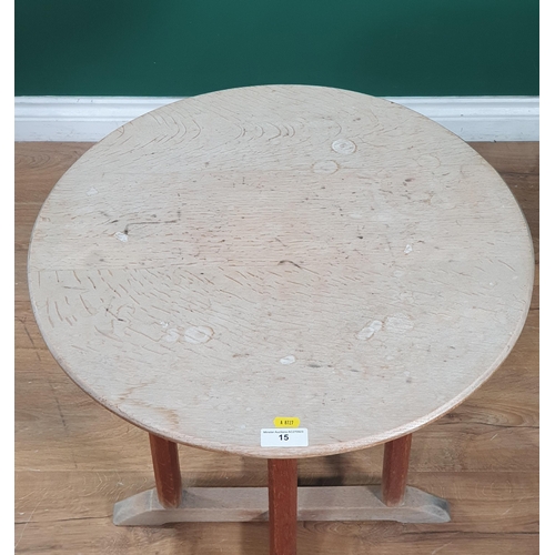 15 - An oak circular topped Occasional Table on four octagonal column supports and quadruple base, 1ft 11... 