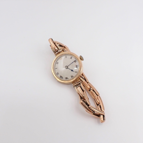 155 - A lady's manual Wristwatch the circular dial with roman numerals in 9ct gold case on expanding brace... 