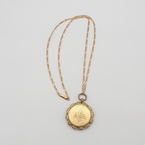 160 - A circular silver-gilt Vinaigrette engraved flowers on yellow metal chain