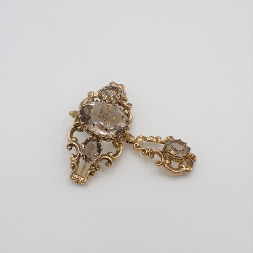 172 - A Victorian style Citrine Brooch claw-set three oval-cut stones in scrolled surround suspending drop... 