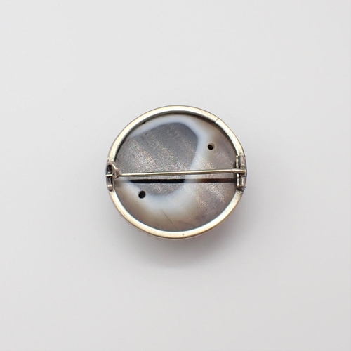 177 - A round ringed Agate brooch in white metal mount