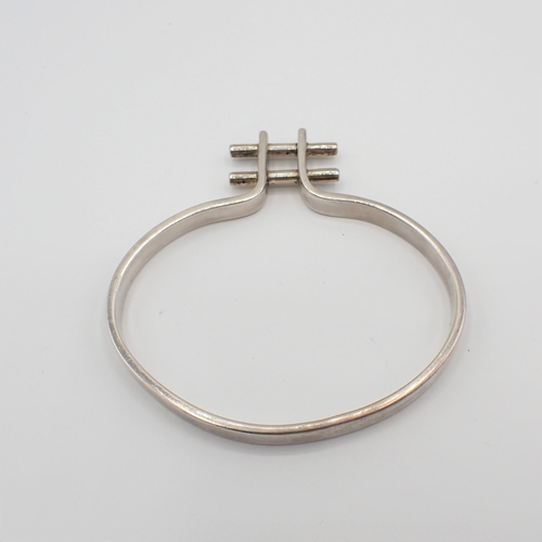 190 - A silver Modernist Bangle