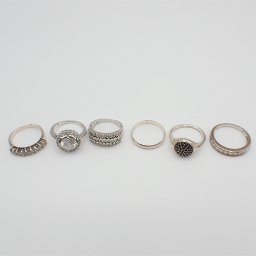 195 - Four Dress Rings stamped 925 and two others, some set CZ