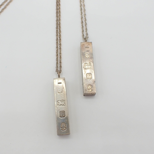 199 - Two silver Ingot Pendants on chains, commemorating Queen Elizabeth II silver jubilee