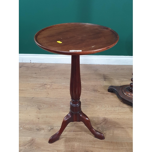 21 - A mahogany Wine Table with circular dished top on reeded baluster column and tripod base, 2ft 2