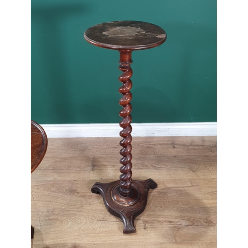 21 - A mahogany Wine Table with circular dished top on reeded baluster column and tripod base, 2ft 2