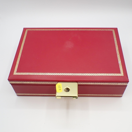 211 - A red jewel box containing Costume Jewellery