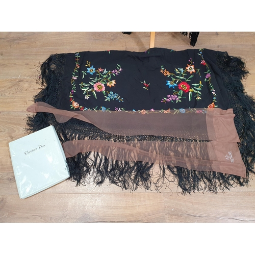 223 - Two black fringed Shawls with floral needlework design in multiple colours, and a pair of Christian ... 