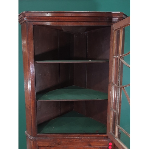 28 - An antique and later oak Standing Corner Cupboard, the top section with single glazed door enclosing... 